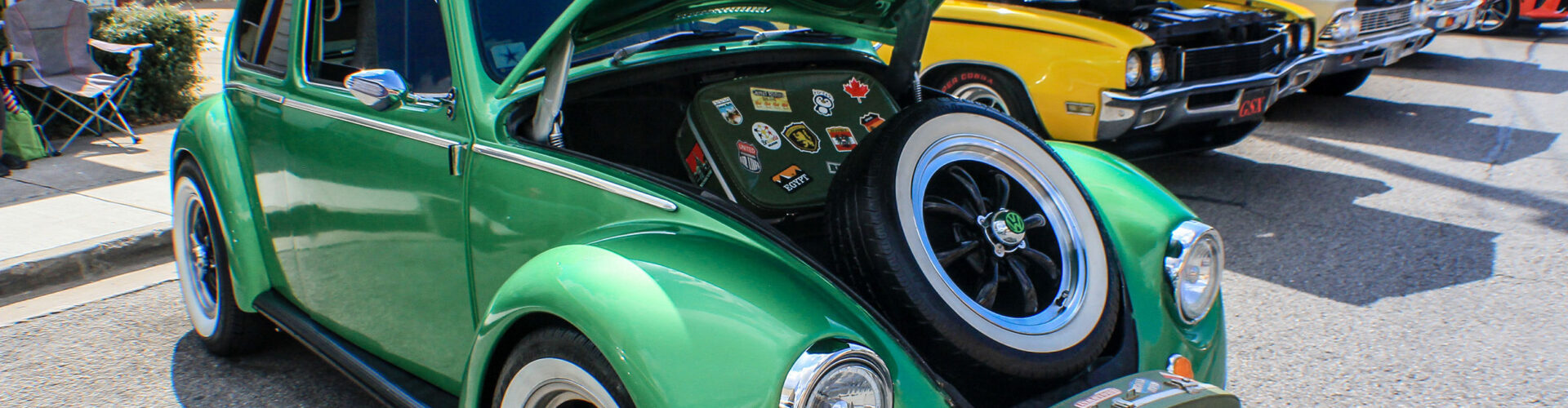 Green Volkswagen Beetle during daytime