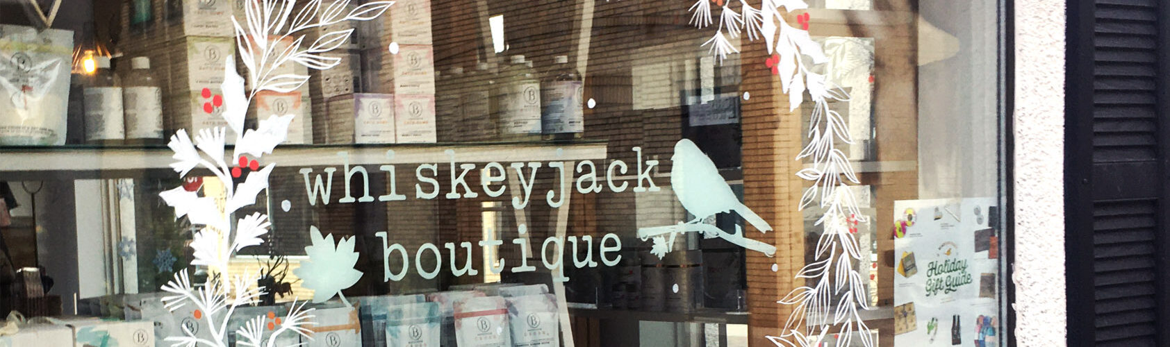 Painted storefront window at Whiskey Jack Boutique