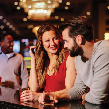 Couple seated at Caesars Windsor bar